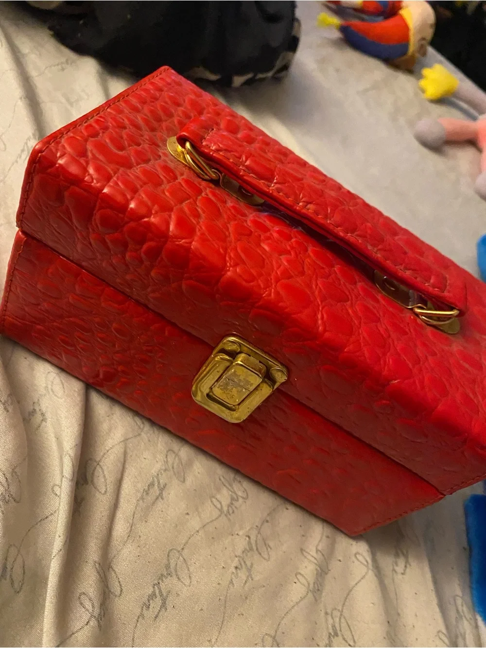 Red Textured Cosmetic Jewelry Case with Gold-Tone Clasp